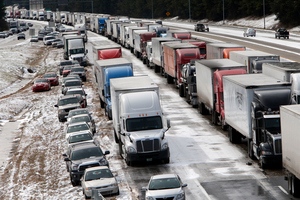 Traffic sits at a standstill on Interstate 459 at US highway 280 as officials work to clear abandoned vehicles. The frigid weather has been blamed for poor US car sales in January. Photo / AP