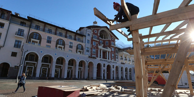 Construction work continues apace outside the Gorki Plaza East hotel in Krasnaya Polyana, Russia. Photo / AP