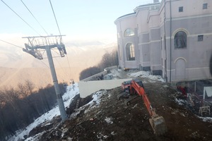 Building debris and a mechanical digger stand outside the Panorama hotel in Krasnaya Polyana, Russia on February 2nd. Photo / AP