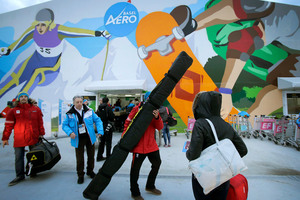 Austria's Winter Olympic team arrives at the airport for the 2014 Winter Olympics amid a threat to kidnap two of its members. Photo / AP