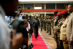 Central African Republic Interim President Catherine Samba-Panza walks the red carpet after addressing newly enlisted FACA (Central African Armed Forces) soldiers in Bangui. Photo / AP