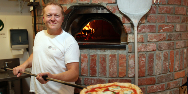 Dante's Pizzeria owner Kevin Morris says they do not have a surcharge, but charge full price for meals instead of the usual special prices. Photo / File