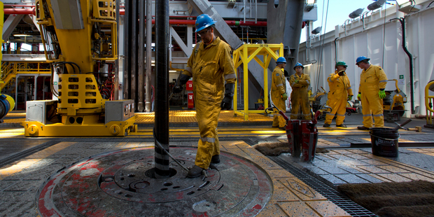 Workers on the Noble Bob Douglas drilling ship. Photo / Brett Phibbs