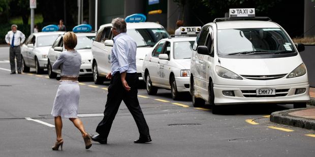 Taxis lined up on Federal Street by Sky City Casino. Car request company Uber is set to launch its app in Auckland and could shake up the taxi industry. Photo / Steven McNicholl