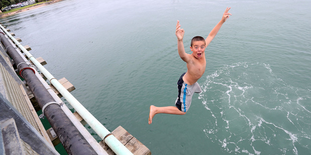 It wouldn't be Waitangi without bridge jumping, Matthew Whui maintains the tradition. PHOTO/John Stone