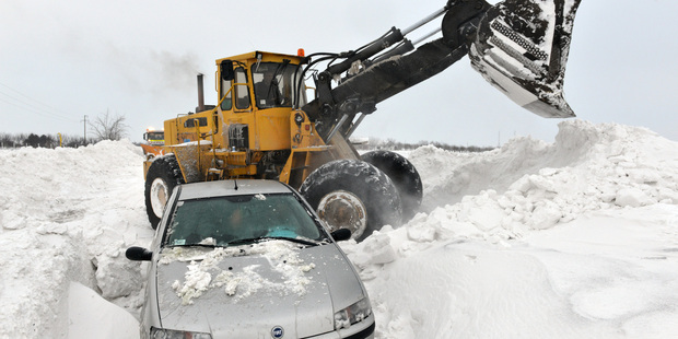 A road sweeping vehicle clears snow from the road near the city of Backa Topola, northern Serbia. Photo / AP
