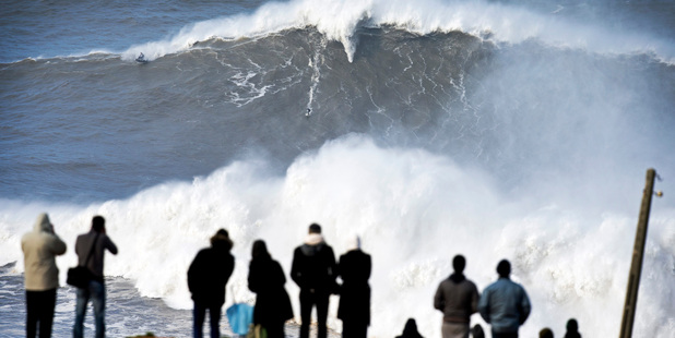 Andrew Cotton rides a giant wave at Praia do Norte, north beach, in Nazare, in Portugal's Atlantic coast. Photo / AP