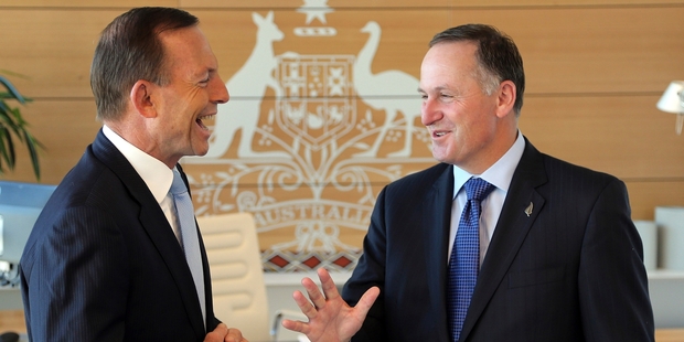 Tony Abbott and John Key seemed to be on the same page at the Commonwealth parliamentary offices in Sydney yesterday. Photo / AP