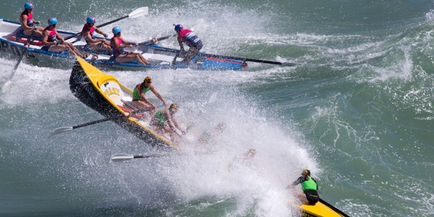 The Paekakariki surfboat crew in action during the Piha Big Wave Classic on Auckland's west coast on Saturday. Photo / Brett Phibbs