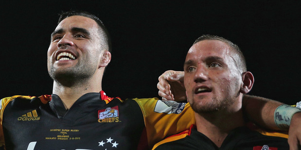 Liam Messam and Aaron Cruden celebrate the Chiefs second Super Rugby title. Photo / Getty