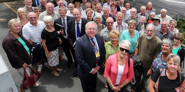 WAITING: Mangawhai Residents and Ratepayers' Association chairman Bruce Rogan (centre) surrounded by other Mangawhai residents who went to the High Court at Whangarei this week seeking a judicial review into the town's controversial sewerage scheme.PHOTO/JOHN STONE