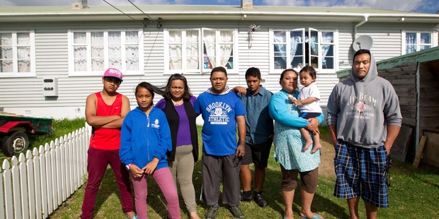 The idea of moving from Thom St in New Lynn doesn't appeal to (from left) Henry Laveaina, 15, Melina Laveaina, 13, Hine Laveaina, Mafa Laveaina, Junior
Laveaina, 14, Vai Sefo (with Christian, 18 months) and Fenika Sefo who share a Housing NZ home. Photo / Richard Robinson