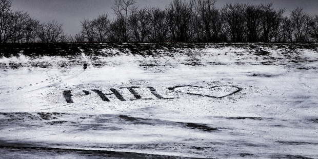Fairport High School old boy Philip Seymour Hoffman is memorialised in the snow (left) near the school as the US becomes more aware of its growing heroin problem. Photo / AP