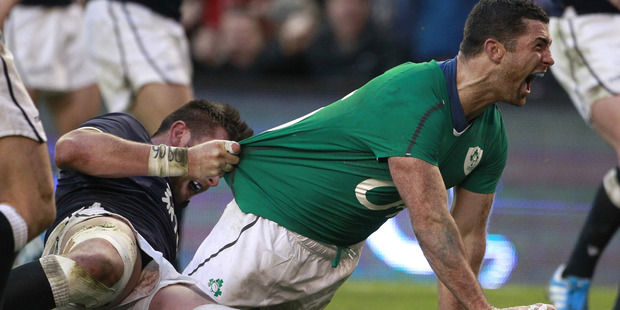 Ireland's Rob Kearney, right, celebrates after scoring against Scotland. Photo / AP