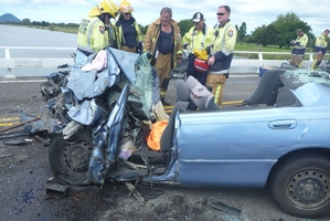 A baby died and three people were injured when this car crashed into a truck. Photo / TrustPower TECT Rescue Helicopter