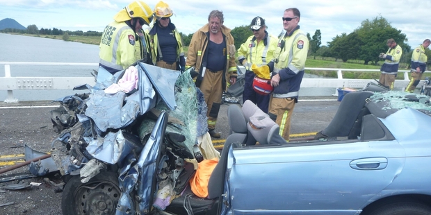 A baby died and three people were injured when this car crashed into a truck. Photo / TrustPower TECT Rescue Helicopter