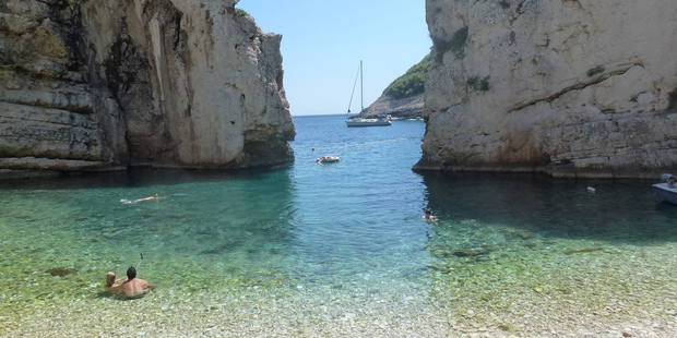 The turquoise waters of Stiniva beach on the Croatian island of Vis - and ice cold drinks - lie at the bottom of a sheer cliff which takes 20 minutes to scrabble down. Photo / Jared Savage
