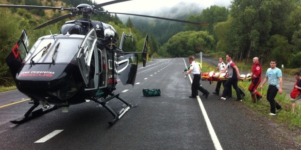 A man who was injured in a diving accident at at Tangoio Falls, about 22km north of Napier, yesterday is carried to the Lowe Corporation Rescue Helicopter.