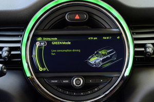 The all-new Mini has the large round dial in the middle of the dash.