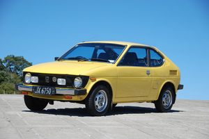 Owner Alan Vessey's daughters are two of the most avid fans of the cute yellow 1980 Suzuki SC100 GX. Pictures / Jacqui Madelin