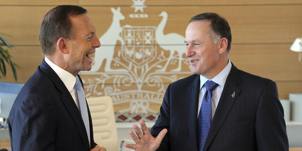 New Zealand Prime Minister John Key, right, is greeted by Australia's Prime Minister Tony Abbott. Photo / Getty Images
