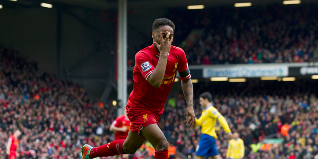 Liverpool's Raheem Sterling celebrates after scoring his second goal against Arsenal during their English Premier League soccer match at Anfield Stadium. Photo / AP