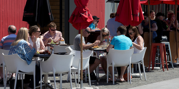 The food and hospitality sectors continue to experience strong spending growth, according to Paymark. People dining at the Wynyard Quarter, Auckland. Photo / Brett Phibbs