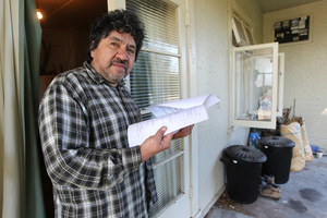 Thomas Martin of Hastings holding papers charging him with not filling out the 2013 census. Photo / Duncan Brown