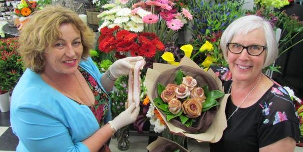 Streaky bacon from Waitaki Bacon and Ham's Sue Morton (left) is made into bouquets and single roses by florist Jonell, Johnson of Jonell's Florists in Oamaru.
Photo / David Bruce