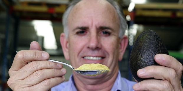 Brian Armstrong holds a tablespoon of avocado powder equal to a whole avocado. Photo/George Novak