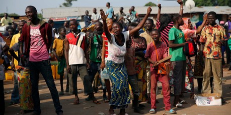 At PK12, the last checkpoint at the exit of the town, the Christian crowd cheers as thousands of Muslim residents flee the town of Bangui. Photo / AP