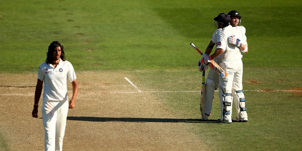 Brendon McCullum celebrates his century with BJ Watling as India's Ishant Sharma walks back. Photo / Getty Images