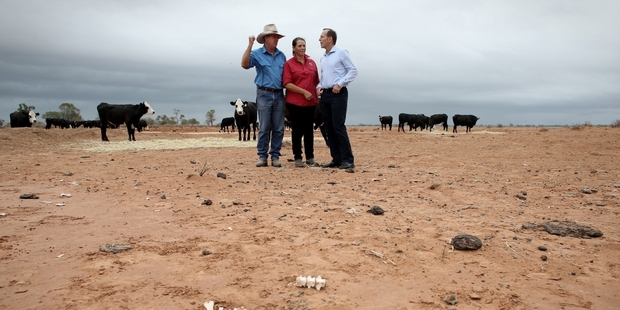 Prime Minister Tony Abbott discusses the drought with NSW graziers Phillip and Di Ridge near Bourke on a tour with Agriculture Minister Barnaby Joyce. Picture / Getty Images