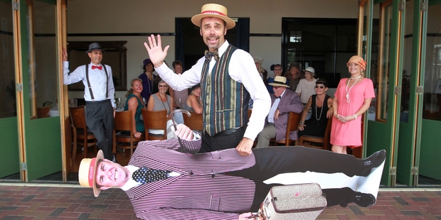 Sales manager Stu Christensen arrives for yesterday's Tremains Art Deco luncheon with the boss - under his wing. Photo/Duncan Brown