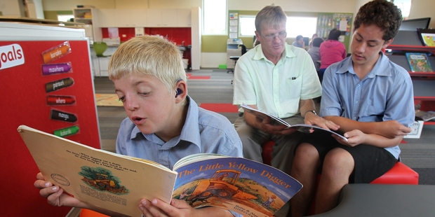 Kaka St Special School has opened up a new satellite unit at Papamoa College. Pictured are students Devon Burt, 12 (left), and Jason Te Pohe, 16, with principal Barrie Wickens. Photo/John Borren