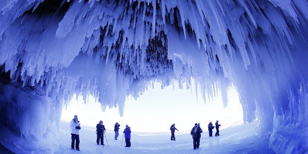 People visit the caves at Apostle Islands National Lakeshore in northern Wisconsin, which have been transformed into dazzling displays of ice sculptures. Photo / AP
