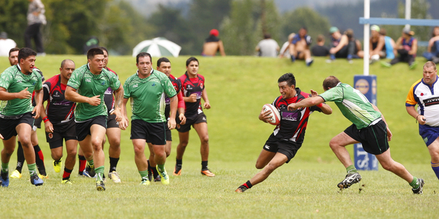 Arataki Sports Club (in red) are encouraging children to "give rugby a go"