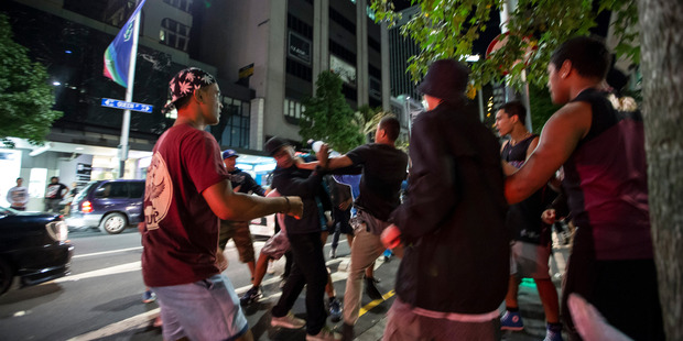 A crowd of youths fight on Queen Street. Photo / Michael Craig