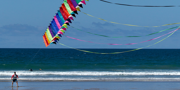 Tom Bicker gave his stunt kite an outing at Mt Maunganui yesterday. Photo / Alan Gibson