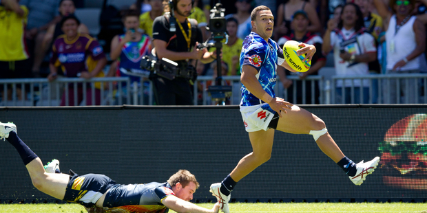 Warriors David Fusitua? scores their first try against the Cowboys in the NRL Auckland Nines at Eden Park, Auckland.16 February 2014 New Zealand Herald Photograph by Richard Robinson.