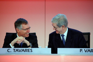 Outgoing PSA Peugeot Citroen Chief Executive Philippe Varin, right, shares a laugh with Carlos Tavares prior to a press conference held at Peugeot headquarters in Paris.