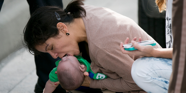 Pamela Rauseo, 37, performs CPR on her nephew, five-month-old Sebastian de la Cruz. AP Photo/The Miami Herald, Al Diaz