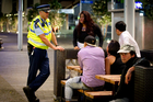 Inspector Gary Davey speaks to young people on Fort Street in the early hours of Thursday morning. Police are showing a heavy presence since changes in alcohol law came into place. Photo / APN Inspector Gary Davey speaks to young people on Fort Street in the early hours of Thursday morning. Police are showing a heavy presence since changes in alcohol law came into place. Photo / APN