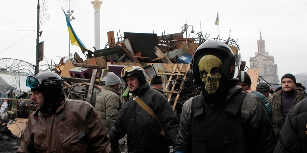 Activists reinforce the barricades in Kiev's Independence Square, the epicentre of Ukraine's unrest. Picture / AP