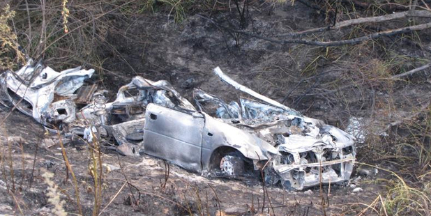 The remains of a car which rolled down a bank and burst into flames. Photo / Lucy Ibbotson