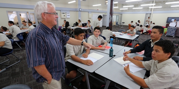 Maths teacher Chris McKay, gives a lesson to junior students from left, Caleb Rawson, Caleb Matthews, Kane Rapana and Tahu Keretene. Photo/John Stone