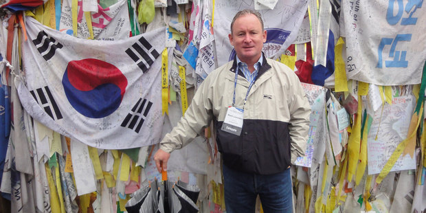 Mark Lowndes at the fence at end of the Freedom Bridge at the Korean Demilitarized Zone.