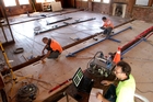 STRENGTH TEST: Engineers Dymtro Dizhur (left) from Ukraine and Iranian Jalil Shafaei, with Italian Ivan Giongo (front) prepare to shake the upper floor of 35B Victoria Ave, Wanganui. STRENGTH TEST: Engineers Dymtro Dizhur (left) from Ukraine and Iranian Jalil Shafaei, with Italian Ivan Giongo (front) prepare to shake the upper floor of 35B Victoria Ave, Wanganui.