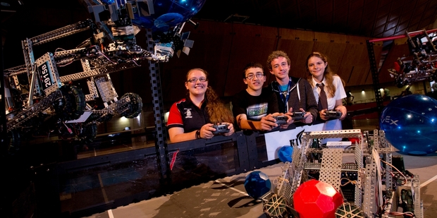 From left: Niamh Conlon, Feilding High; Conor Thomas, Lynfield College, Logan Davy, Otumoetai College; and Jess Chase Long Bay College prepare for the robotics competition. Photo / Dean Purcell
