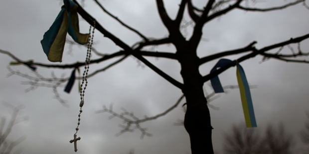 Rosary beads hang from a tree in Kiev's Independence Square, epicentre of Ukraine's unrest. Photo / AP